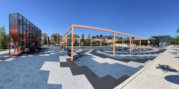 Climbing structure and swings at Rouge Crest Park